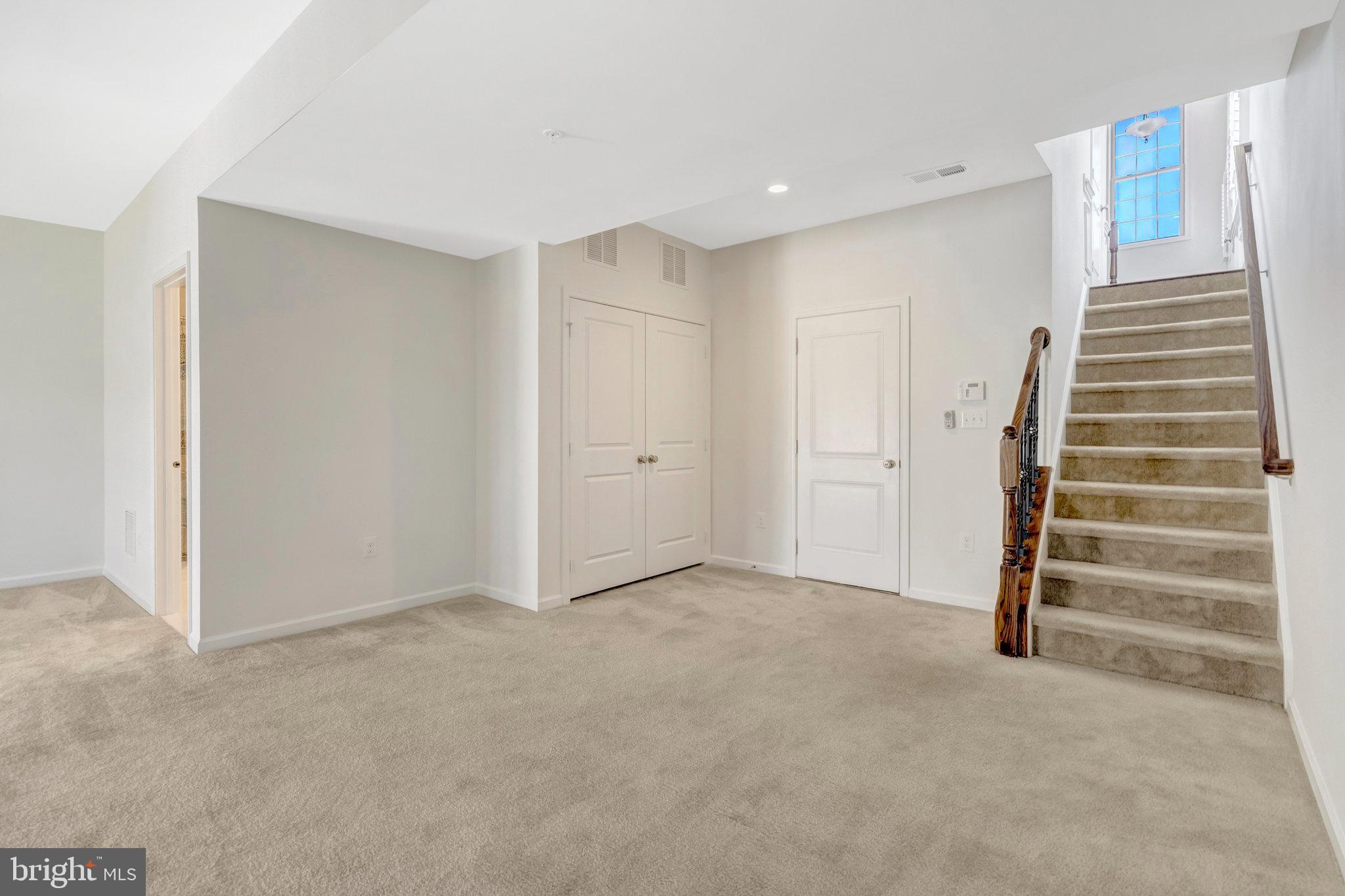 42634 Lancaster Ridge Terrace Chantilly, VA 20152 - Photo 50 of 63 a view of an empty room with a fireplace