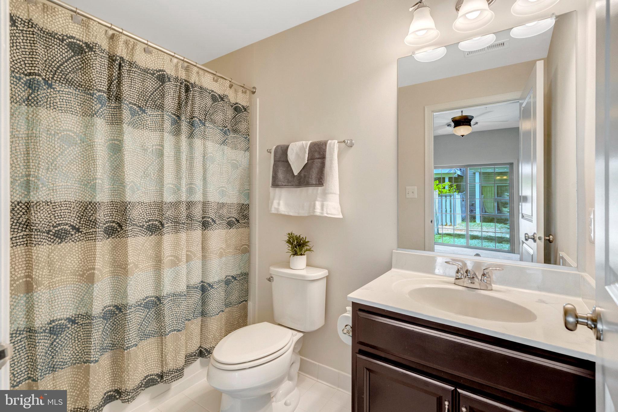42634 Lancaster Ridge Terrace Chantilly, VA 20152 - Photo 53 of 63 a bathroom with a sink toilet and shower