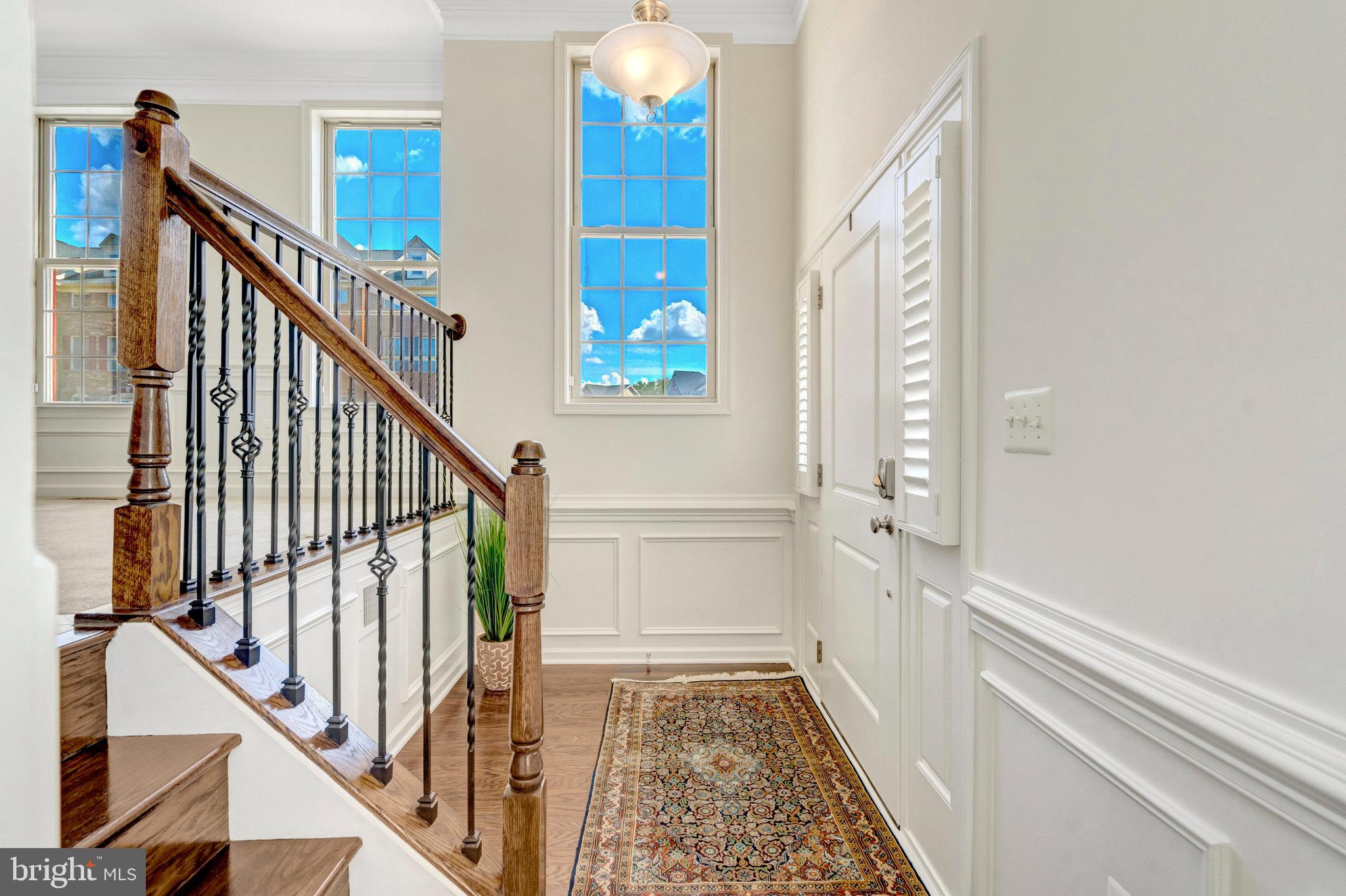 42634 Lancaster Ridge Terrace Chantilly, VA 20152 - Photo 6 of 63 a view of staircase with wooden floor and a rug