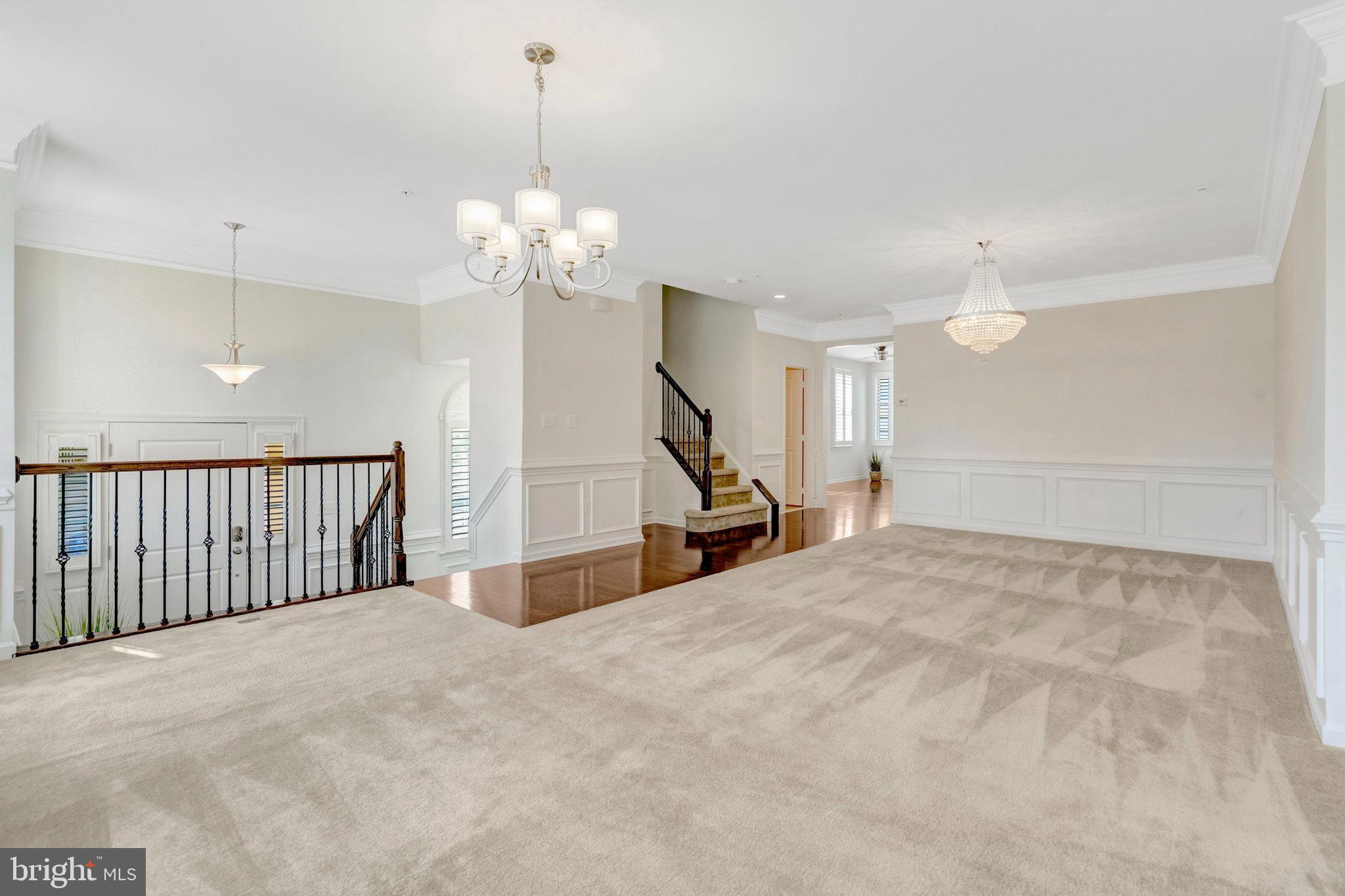 42634 Lancaster Ridge Terrace Chantilly, VA 20152 - Photo 9 of 63 a view of an empty room with a chandelier fan