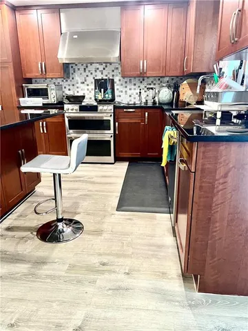 a living room with fireplace furniture and a flat screen tv