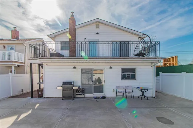 a view of a chair and tables in the house