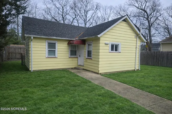 a view of a backyard of the house