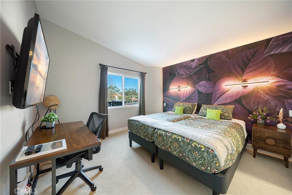 72 Corniche Drive, Unit E Dana Point, CA 92629 - Photo 13 of 61 a bedroom with a bed table and a flat screen tv