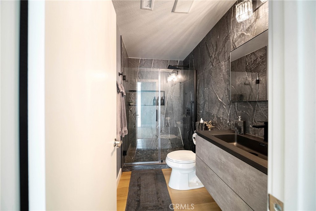 72 Corniche Drive, Unit E Dana Point, CA 92629 - Photo 16 of 61 a bathroom with a sink and a toilet