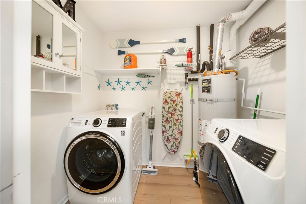 72 Corniche Drive, Unit E Dana Point, CA 92629 - Photo 22 of 61 a view of washer and dryer in a kitchen