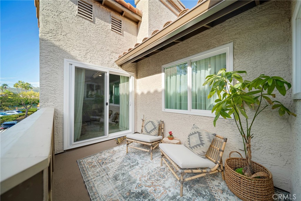 72 Corniche Drive, Unit E Dana Point, CA 92629 - Photo 23 of 61 a living room with furniture and a potted plant