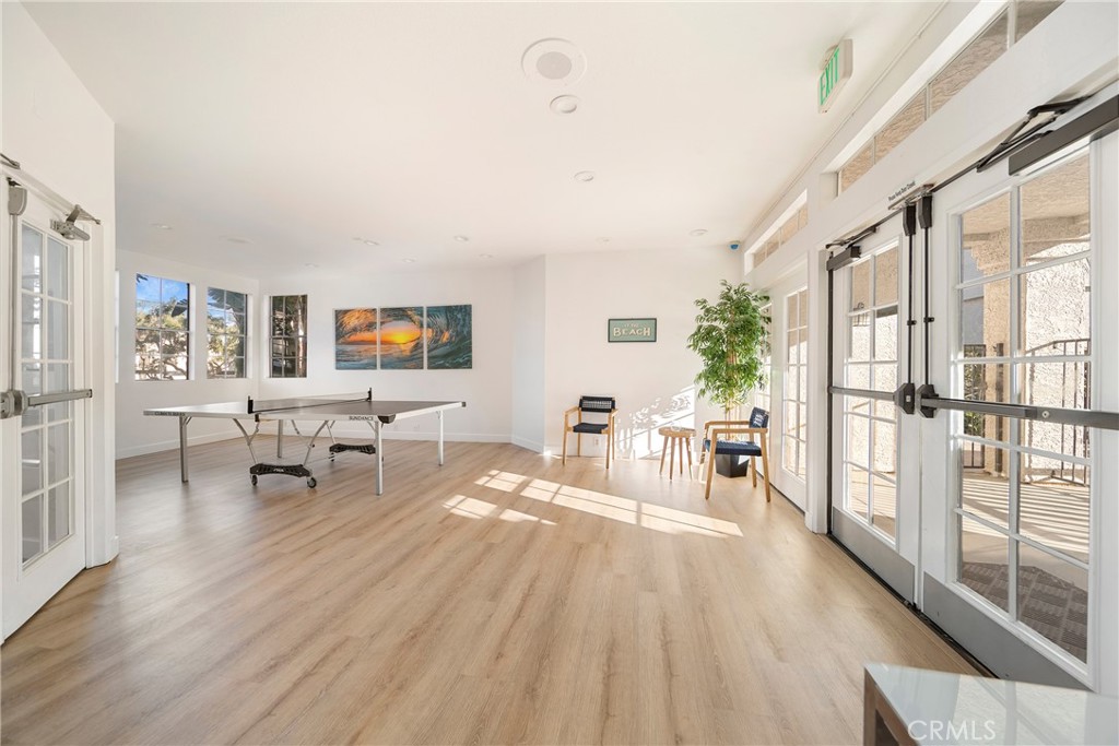 72 Corniche Drive, Unit E Dana Point, CA 92629 - Photo 41 of 61 a living room with furniture and a wooden floor