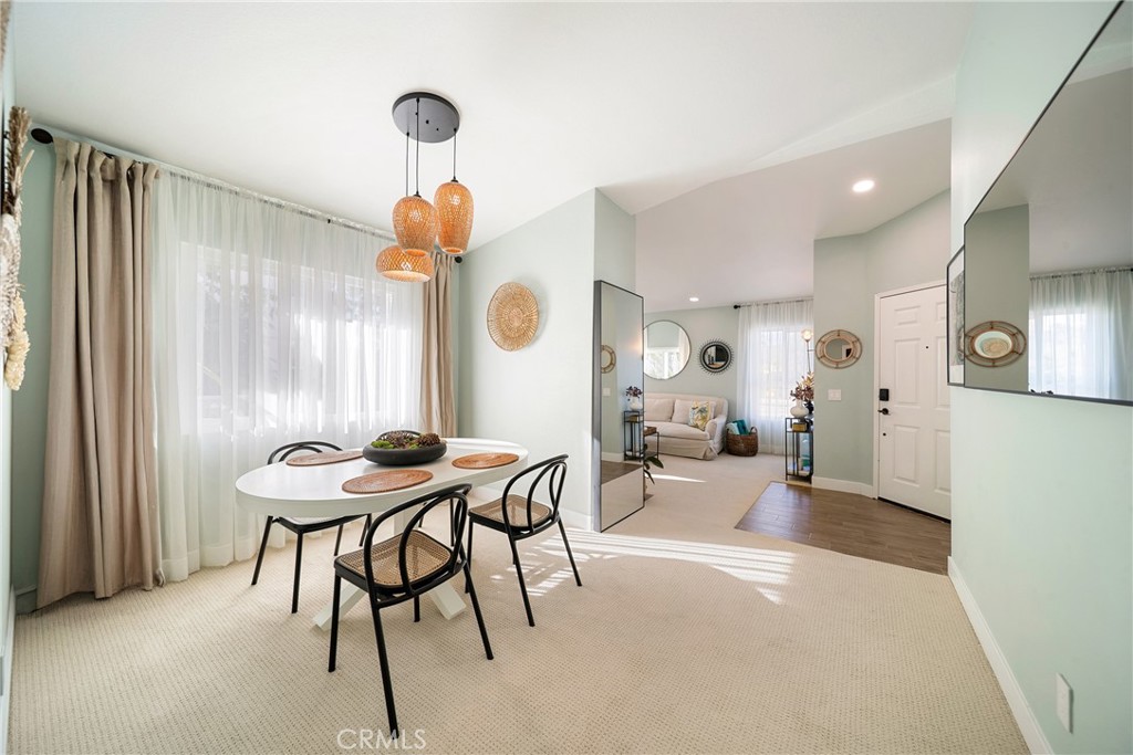 72 Corniche Drive, Unit E Dana Point, CA 92629 - Photo 6 of 61 a view of a dining room with furniture and a chandelier