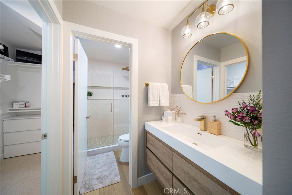 72 Corniche Drive, Unit E Dana Point, CA 92629 - Photo 10 of 61 a bathroom with a sink and a mirror