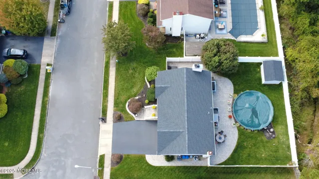 a view of a house with a yard and sitting area