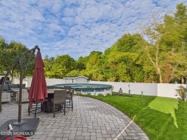 a room with a wooden floor and a window