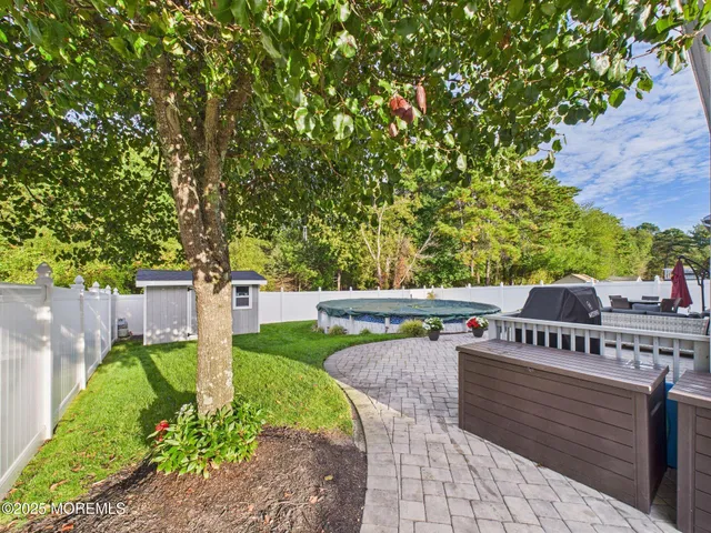 a kitchen with kitchen island granite countertop lots of counter top space and stainless steel appliances