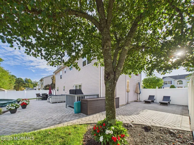 a bedroom with a bed and a dresser in it