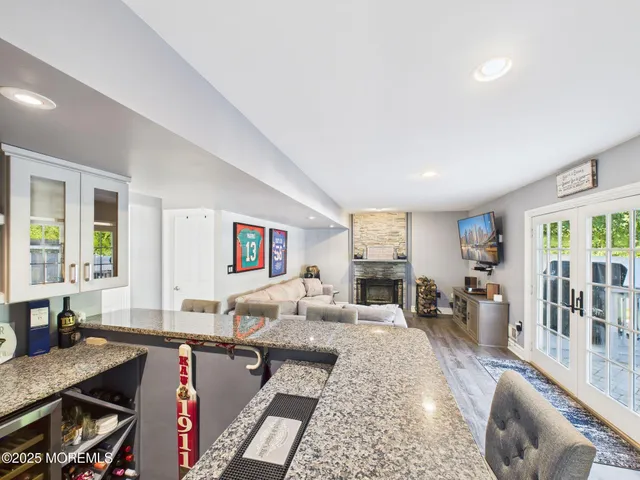 a kitchen with stainless steel appliances granite countertop wooden cabinets a sink and dishwasher