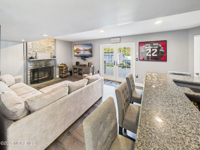 a bedroom with bed and a book shelf