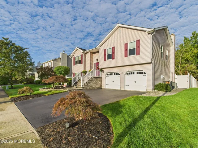 an aerial view of a house with swimming pool and garden
