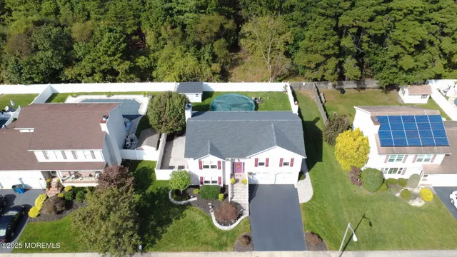 an aerial view of a house with garden space sitting space and swimming pool
