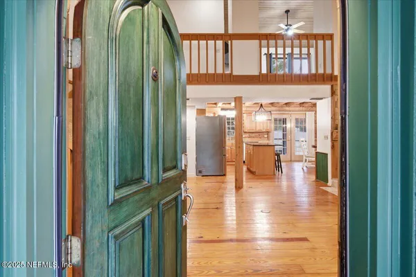 a kitchen with a table and chairs