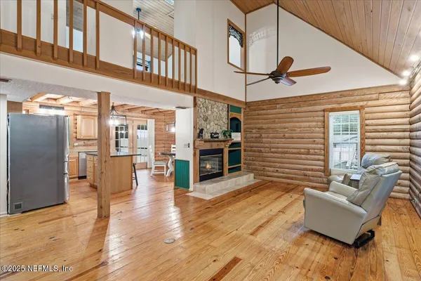 a kitchen with stainless steel appliances granite countertop a sink a stove and refrigerator