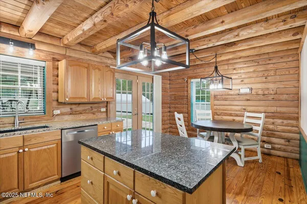 a bedroom with a bed a stove and a window