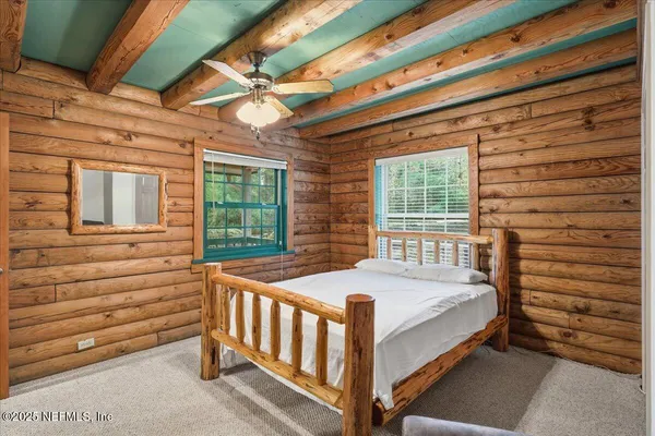 a bathroom with a granite countertop shower sink and mirror