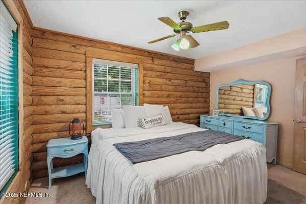 a view of a backyard with sitting area