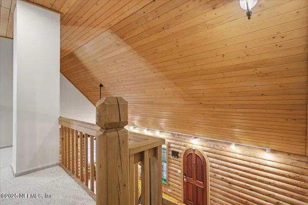 a kitchen with a refrigerator and a stove top oven
