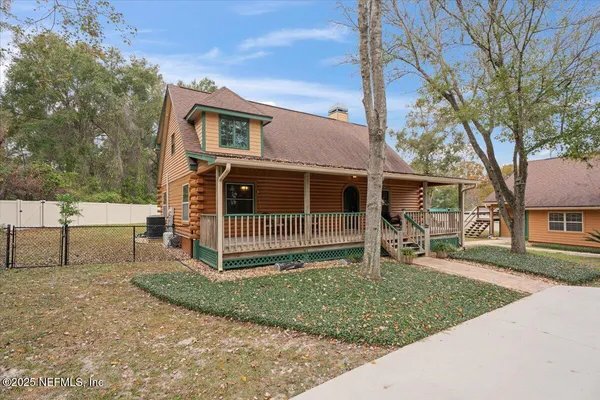 a balcony with with furniture and wooden floor