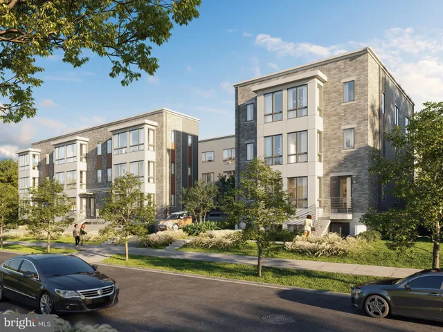 a car parked in front of a brick building