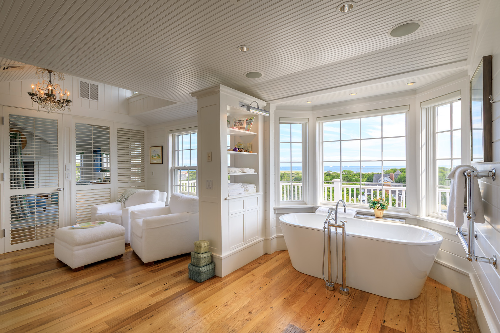 45 Cliff Road Nantucket, MA 02554 - Photo 22 of 36 a living room with furniture and large windows