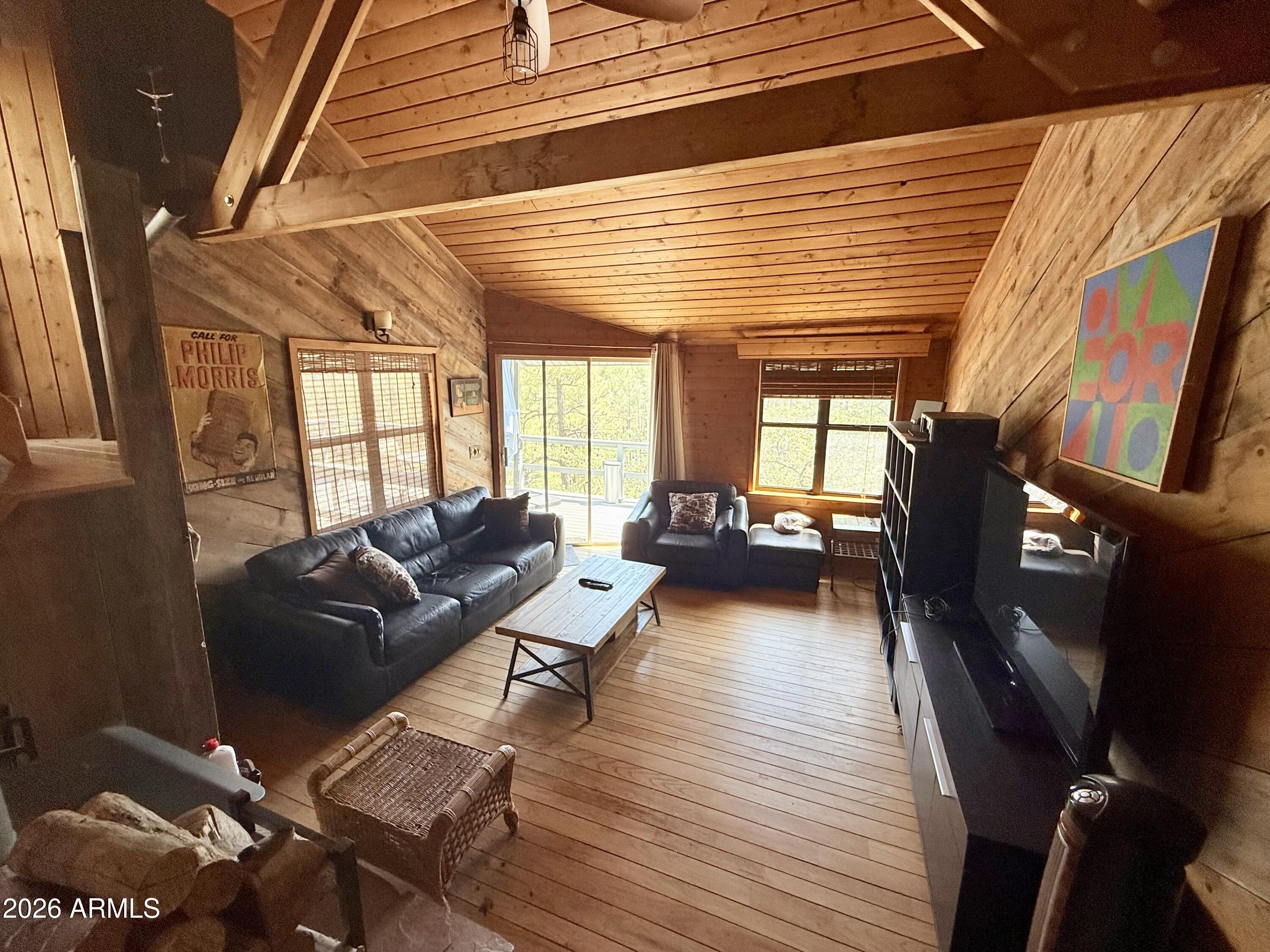 6687 Mountain View Road Crown King, AZ 86343 - Photo 2 of 18 a living room with furniture and a wooden floor
