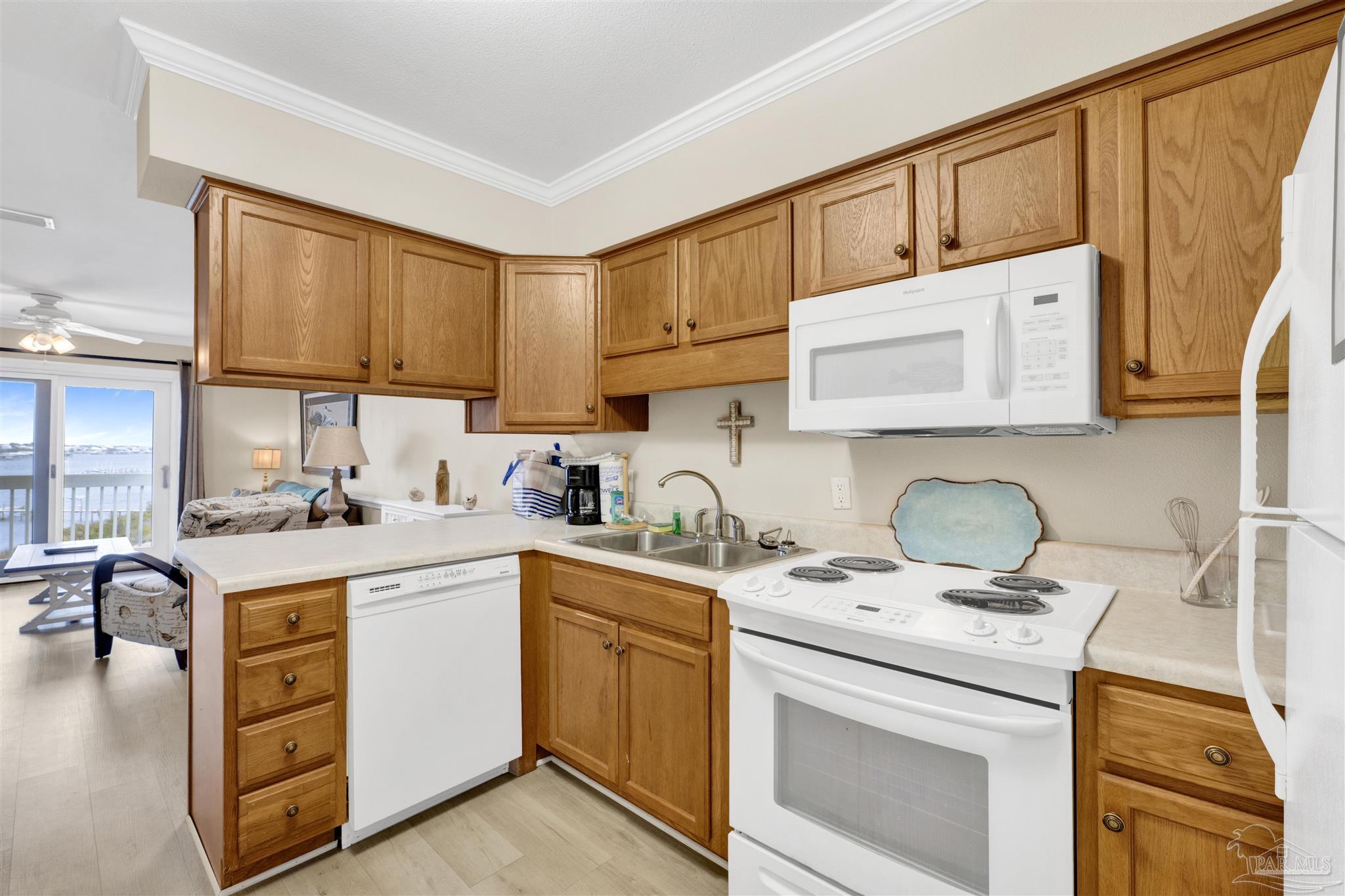 16310 Perdido Key Drive, Unit 12C Perdido Key, FL 32507 - Photo 13 of 32 a kitchen with cabinets appliances a sink and a counter top space