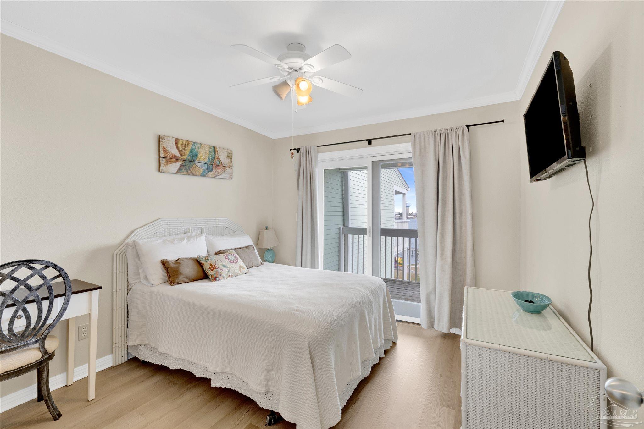 16310 Perdido Key Drive, Unit 12C Perdido Key, FL 32507 - Photo 14 of 32 a bedroom with a bed and a flat screen tv