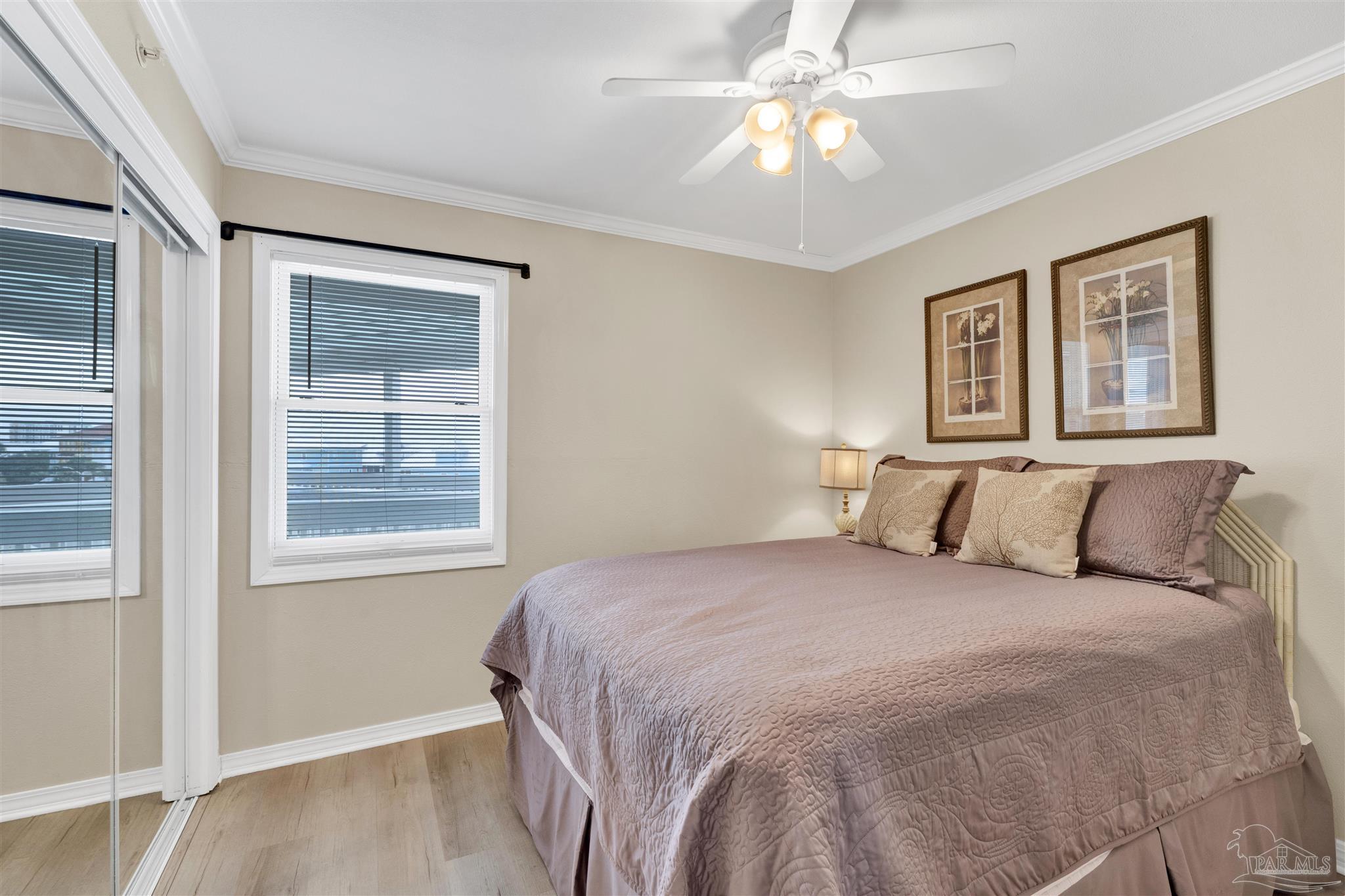 16310 Perdido Key Drive, Unit 12C Perdido Key, FL 32507 - Photo 17 of 32 a bedroom with a large bed and a window