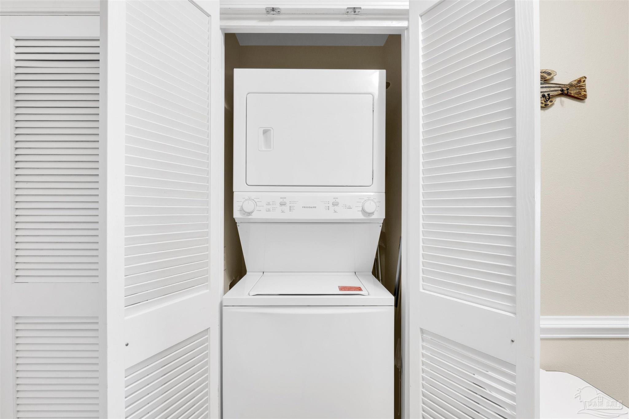 16310 Perdido Key Drive, Unit 12C Perdido Key, FL 32507 - Photo 20 of 32 a utility room with dryer and washer