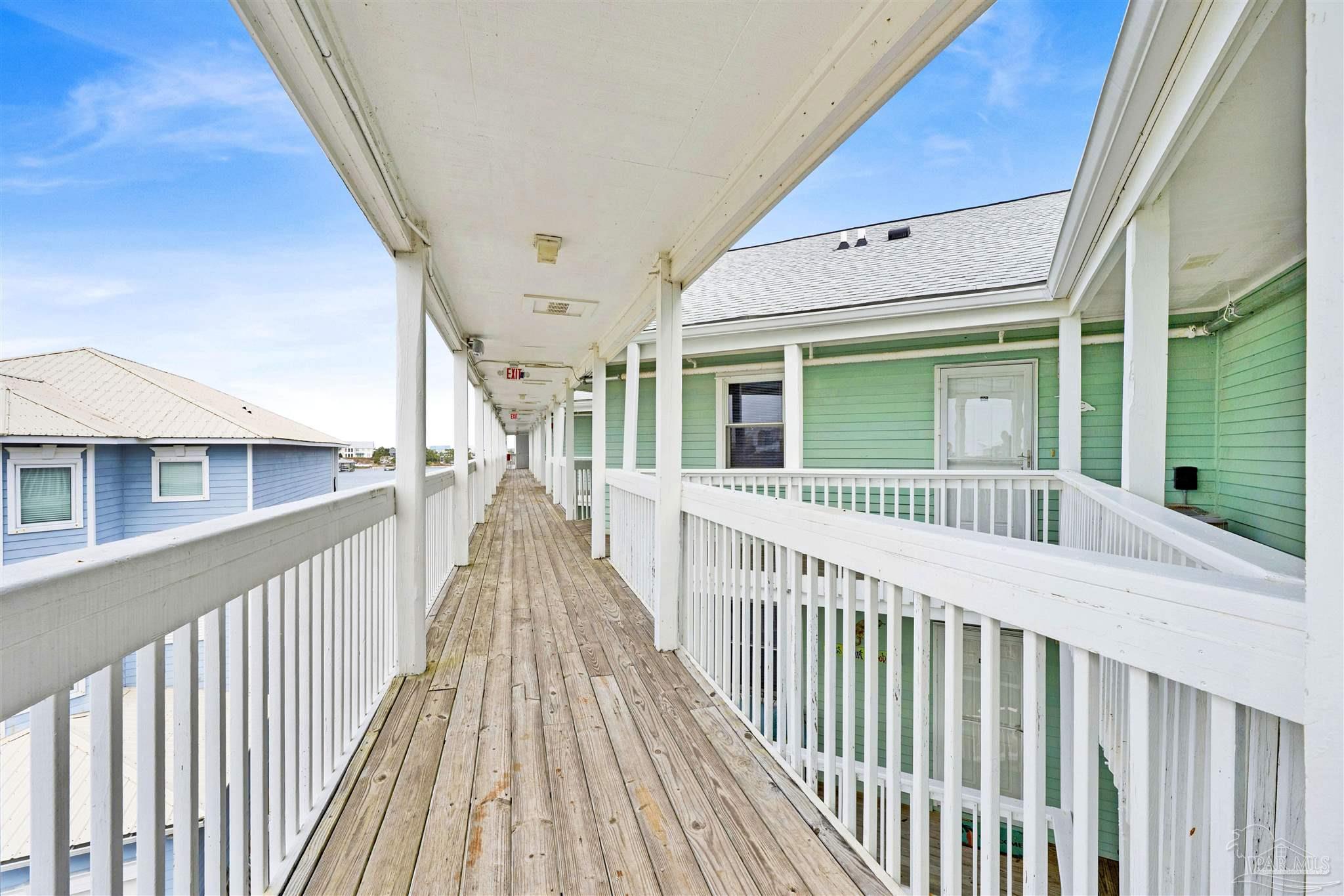 16310 Perdido Key Drive, Unit 12C Perdido Key, FL 32507 - Photo 21 of 32 a view of a house with deck and wooden floor