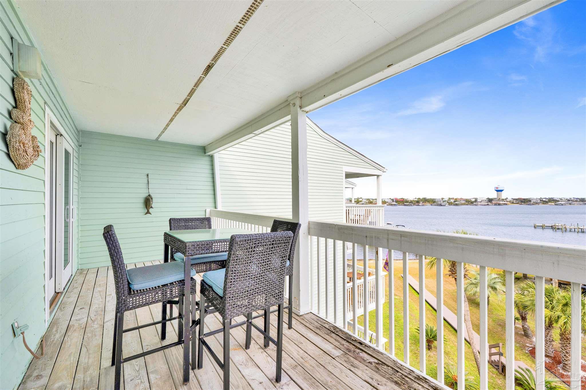 16310 Perdido Key Drive, Unit 12C Perdido Key, FL 32507 - Photo 6 of 32 a view of a chairs and table in the balcony