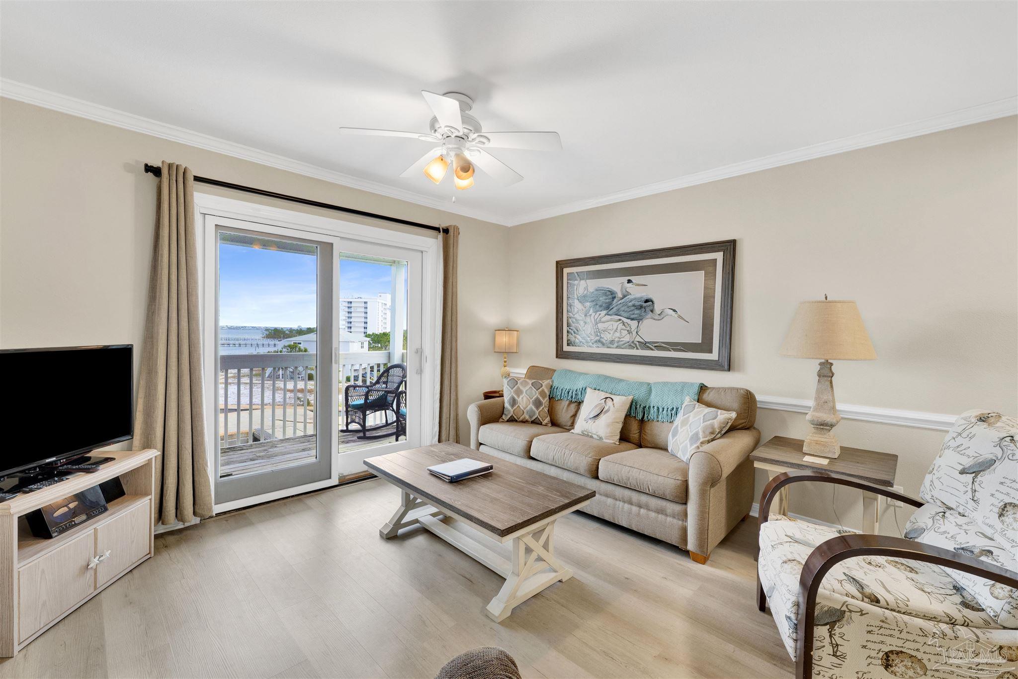 16310 Perdido Key Drive, Unit 12C Perdido Key, FL 32507 - Photo 7 of 32 a living room with furniture and flat screen tv