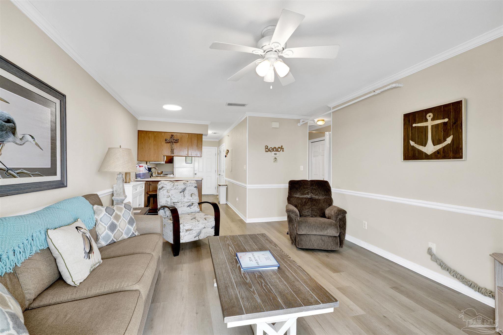 16310 Perdido Key Drive, Unit 12C Perdido Key, FL 32507 - Photo 9 of 32 a living room with furniture and wooden floor