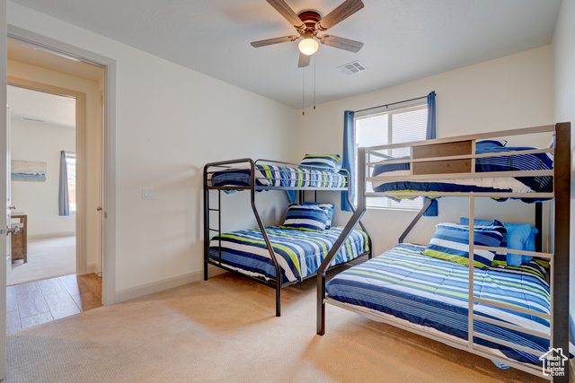 1329 Paseos Street Washington, UT 84780 - Photo 11 of 35 Bedroom featuring light carpet and a ceiling fan