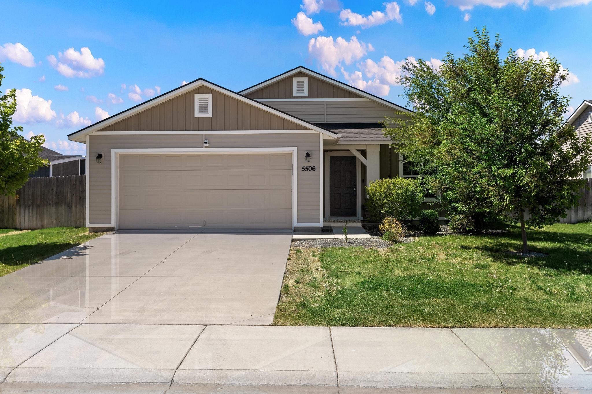 5506 Barkley Way Caldwell, ID 83607 - Photo 1 of 34 Single-story residence featuring light gray siding with tan gable accents and trim