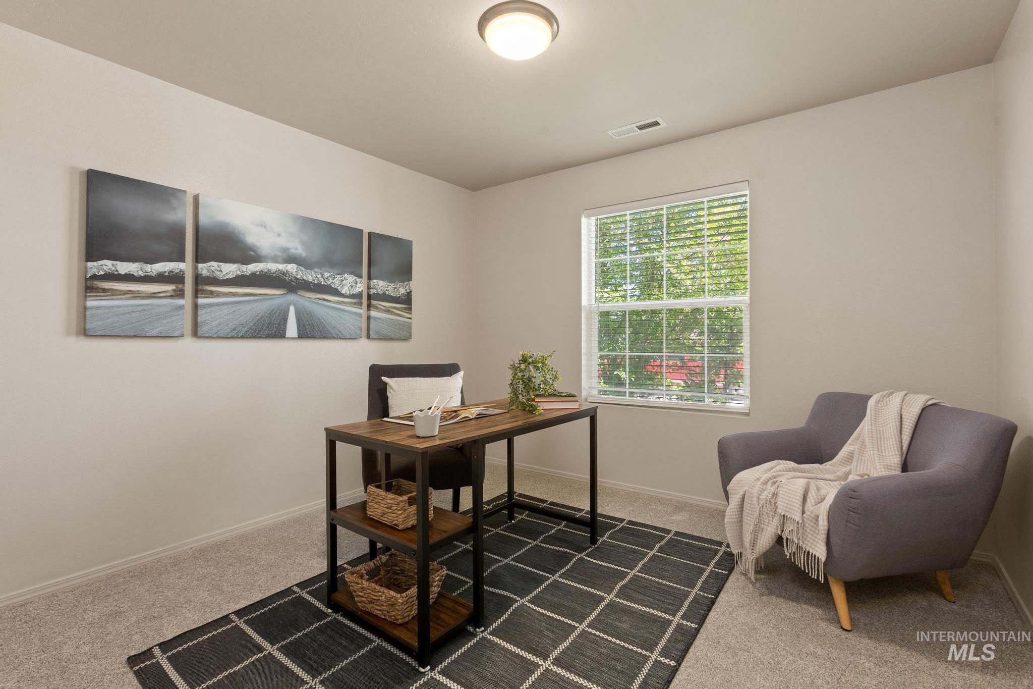 5506 Barkley Way Caldwell, ID 83607 - Photo 18 of 34 Bright room featuring neutral wall paint, light gray carpet, and a white-framed window