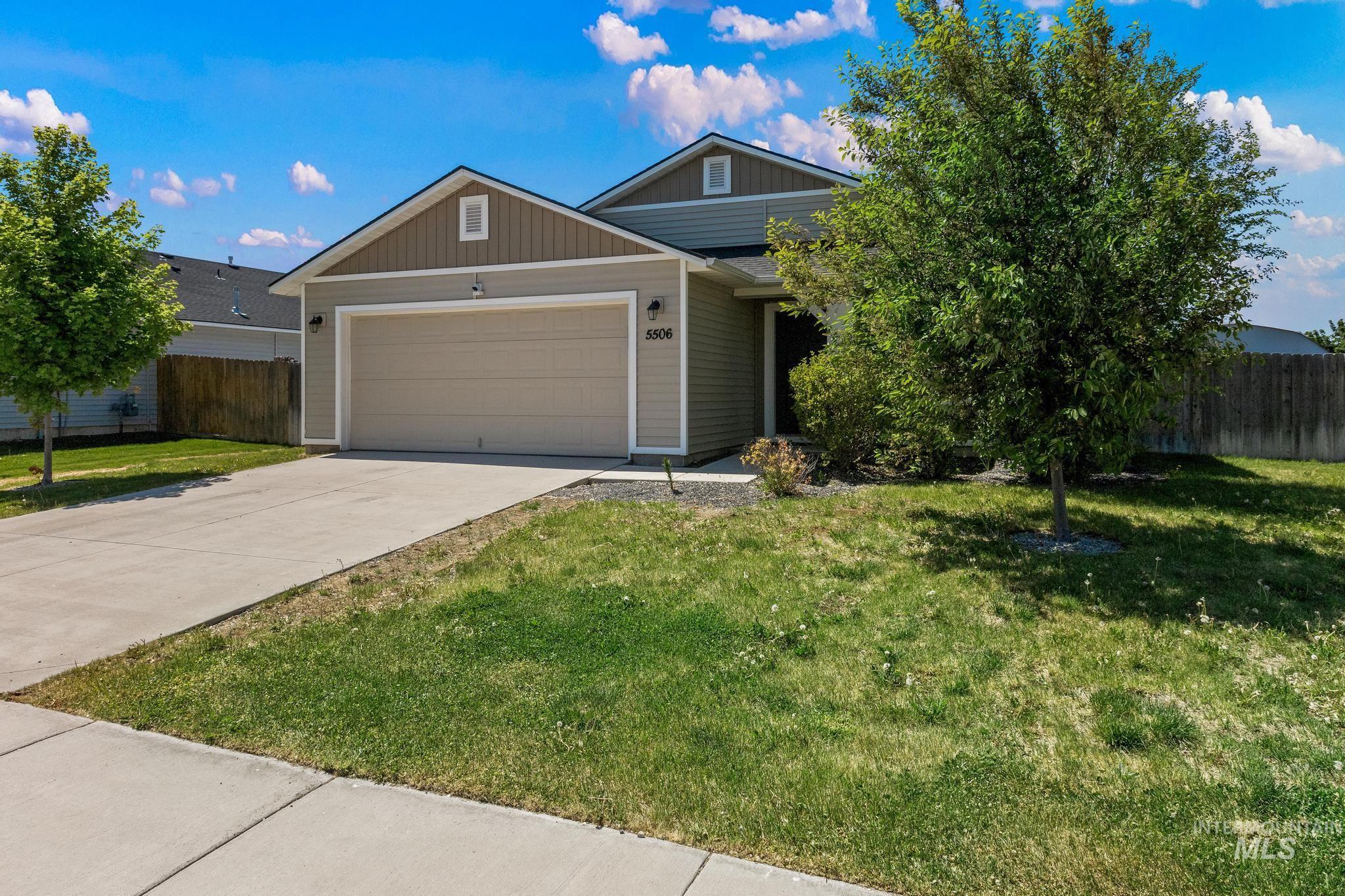 5506 Barkley Way Caldwell, ID 83607 - Photo 3 of 34 Single-story residence featuring light gray siding with tan accents and a prominent two-car garage