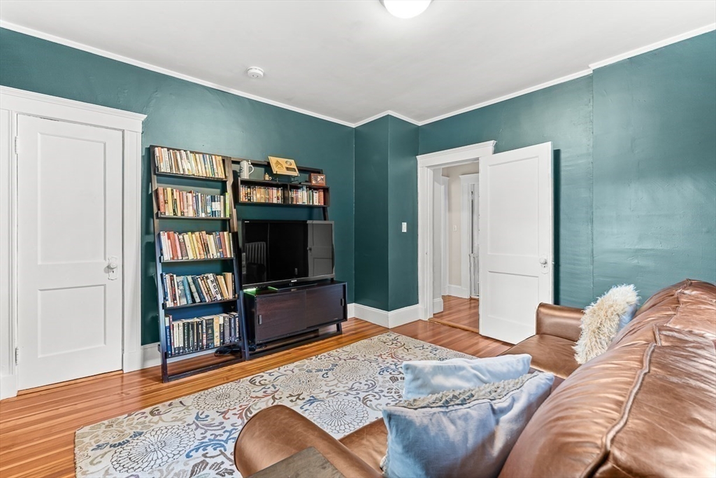 55 Redlands Road Boston, MA 02132 - Photo 24 of 42 a bedroom with bed and a flat screen tv