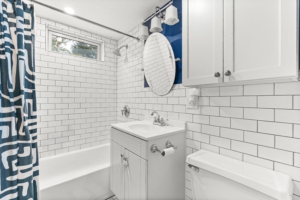 55 Redlands Road Boston, MA 02132 - Photo 25 of 42 a bathroom with a sink toilet and shower