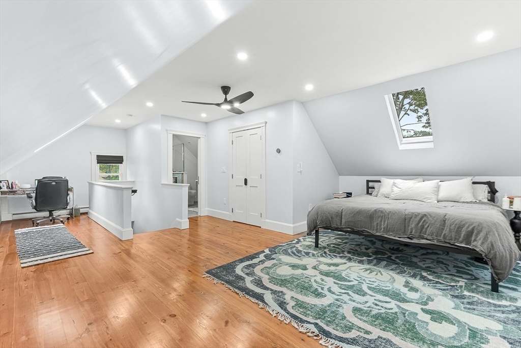 55 Redlands Road Boston, MA 02132 - Photo 30 of 42 a bedroom with a large bed and a view of kitchen