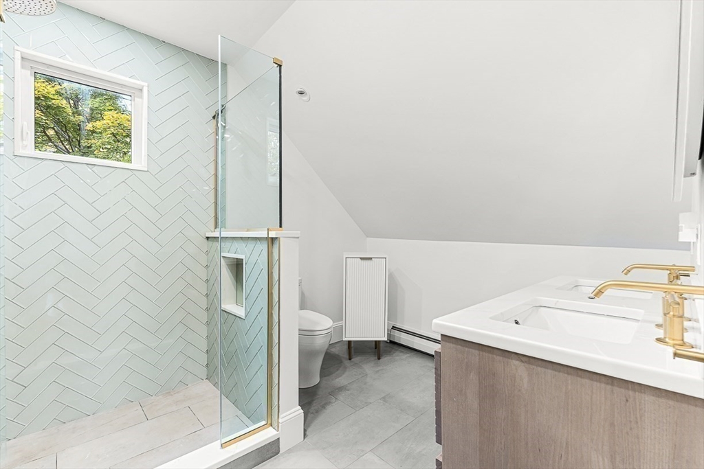 55 Redlands Road Boston, MA 02132 - Photo 32 of 42 a bathroom with a sink toilet and shower