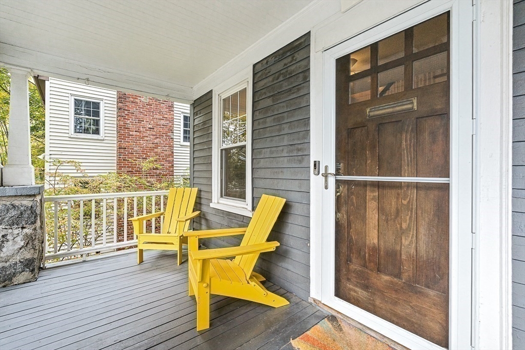 55 Redlands Road Boston, MA 02132 - Photo 36 of 42 a view of deck with wooden floor and outdoor seating