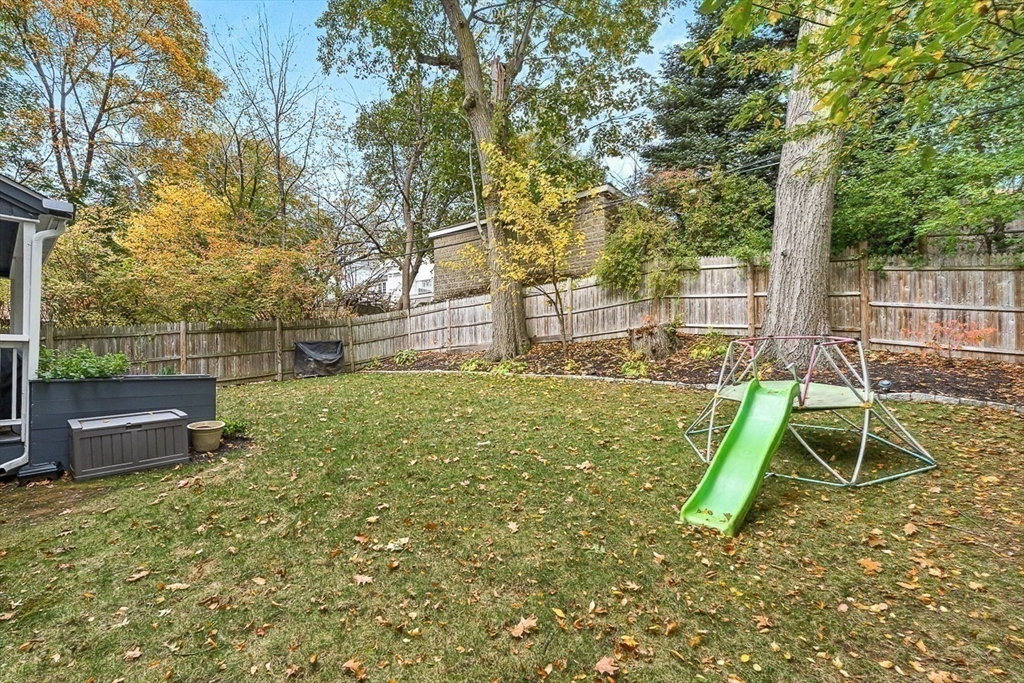 55 Redlands Road Boston, MA 02132 - Photo 41 of 42 a view of a backyard with a slide